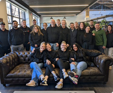 A group of employees gathered together for a group photo