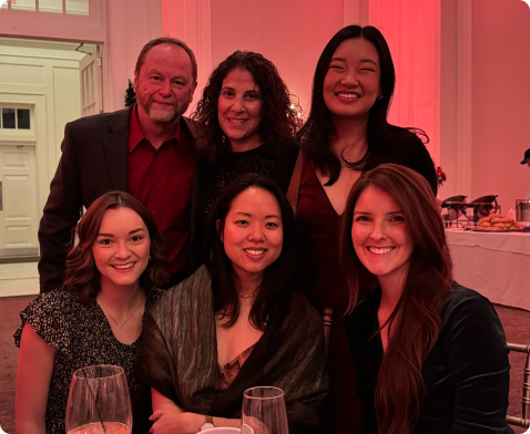 Employees gathered together for a group photo during holiday party